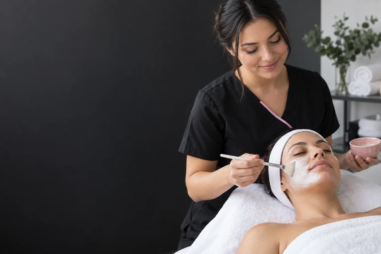 AI-generated scene of an esthetics student applying a facial mask with a brush.